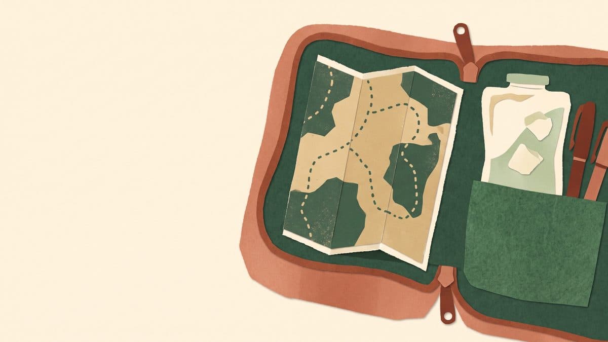 Paper-cut illustration of an open travel case holding pens, a gel ice pack and a folded map with dotted routes